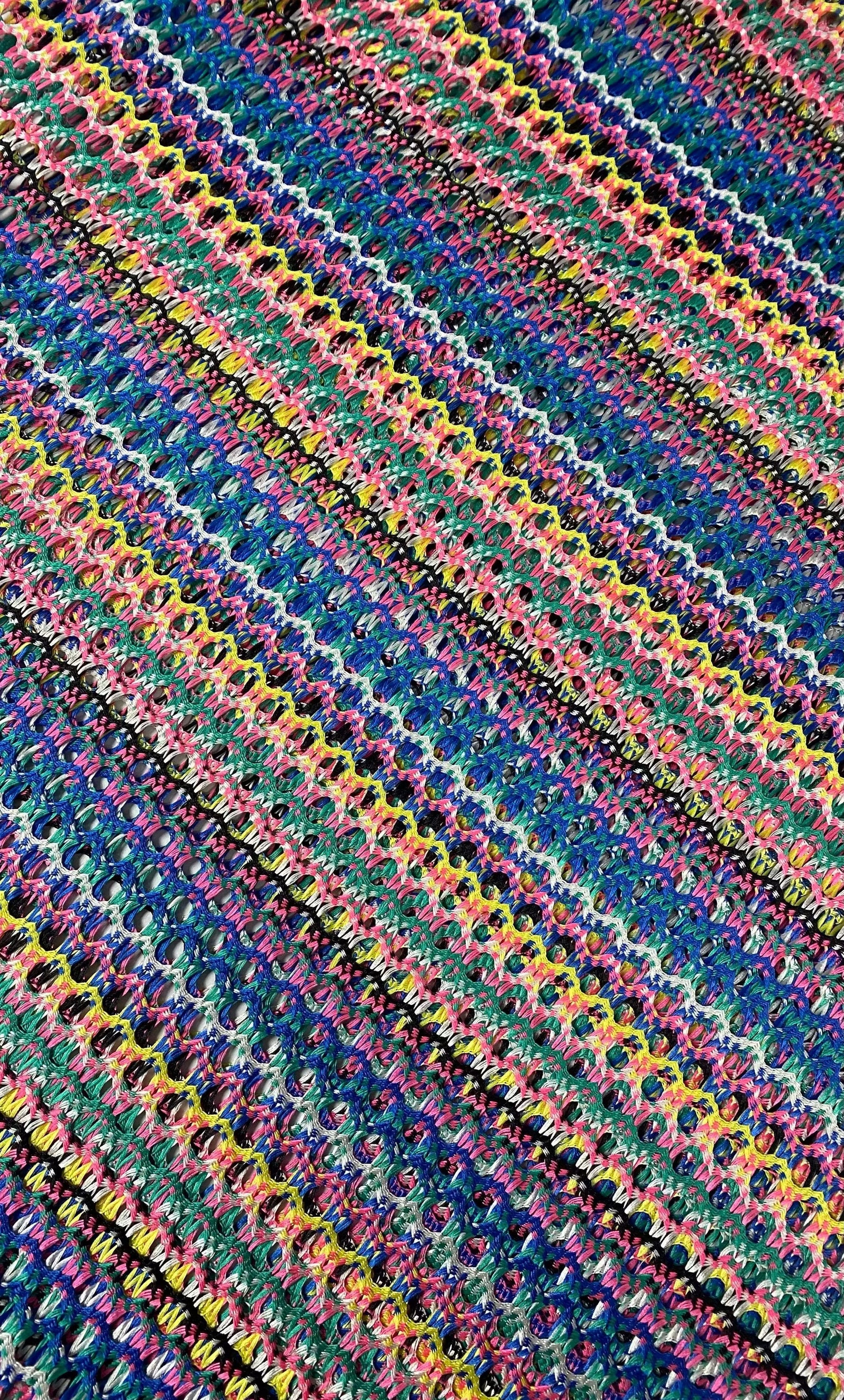 Multicolor chevron zigzag knit jersey fabric with vibrant stripes for apparel and crafts