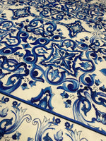 Mojalica Design Upholstery Fabric with intricate blue floral and geometric patterns on cream polyester material