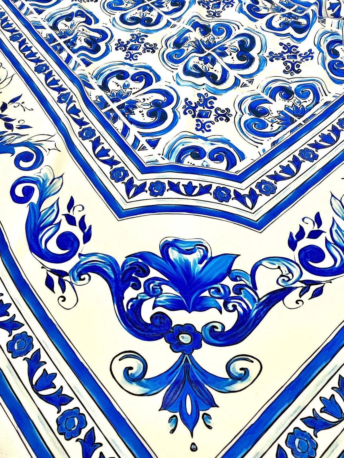 Blue Majolica silky crepe fabric with intricate blue floral and decorative patterns on a white background