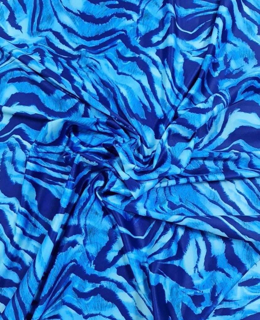 Blue zebra print fabric with vibrant stripe pattern and 150cm width for sewing projects