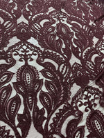 Bordeaux floral pattern lace fabric with intricate designs for fashion and decor projects