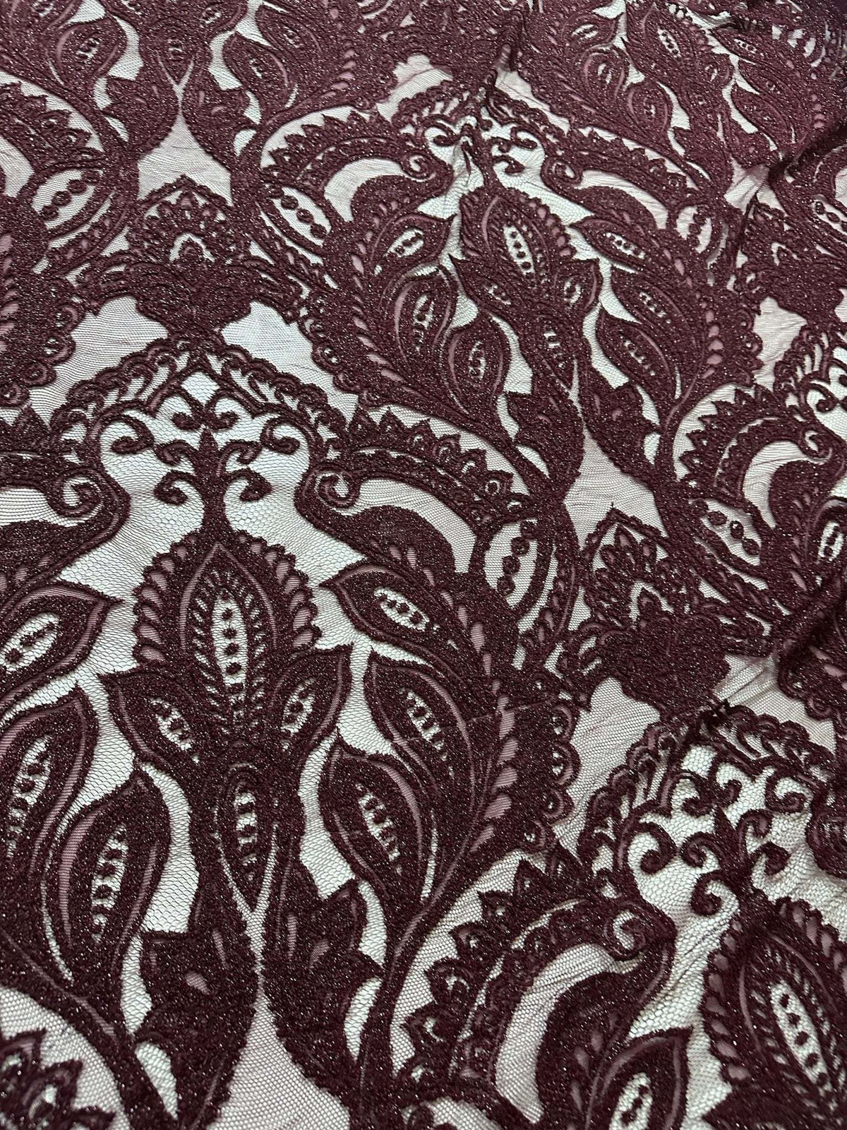Bordeaux floral pattern lace fabric with intricate designs for fashion and decor projects