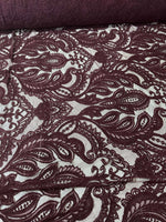 Bordeaux floral pattern lace fabric with intricate floral design suitable for fashion and craft projects