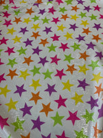 Colorful stars sequin fabric with 2-way stretch, ideal for stylish evening wear and garments