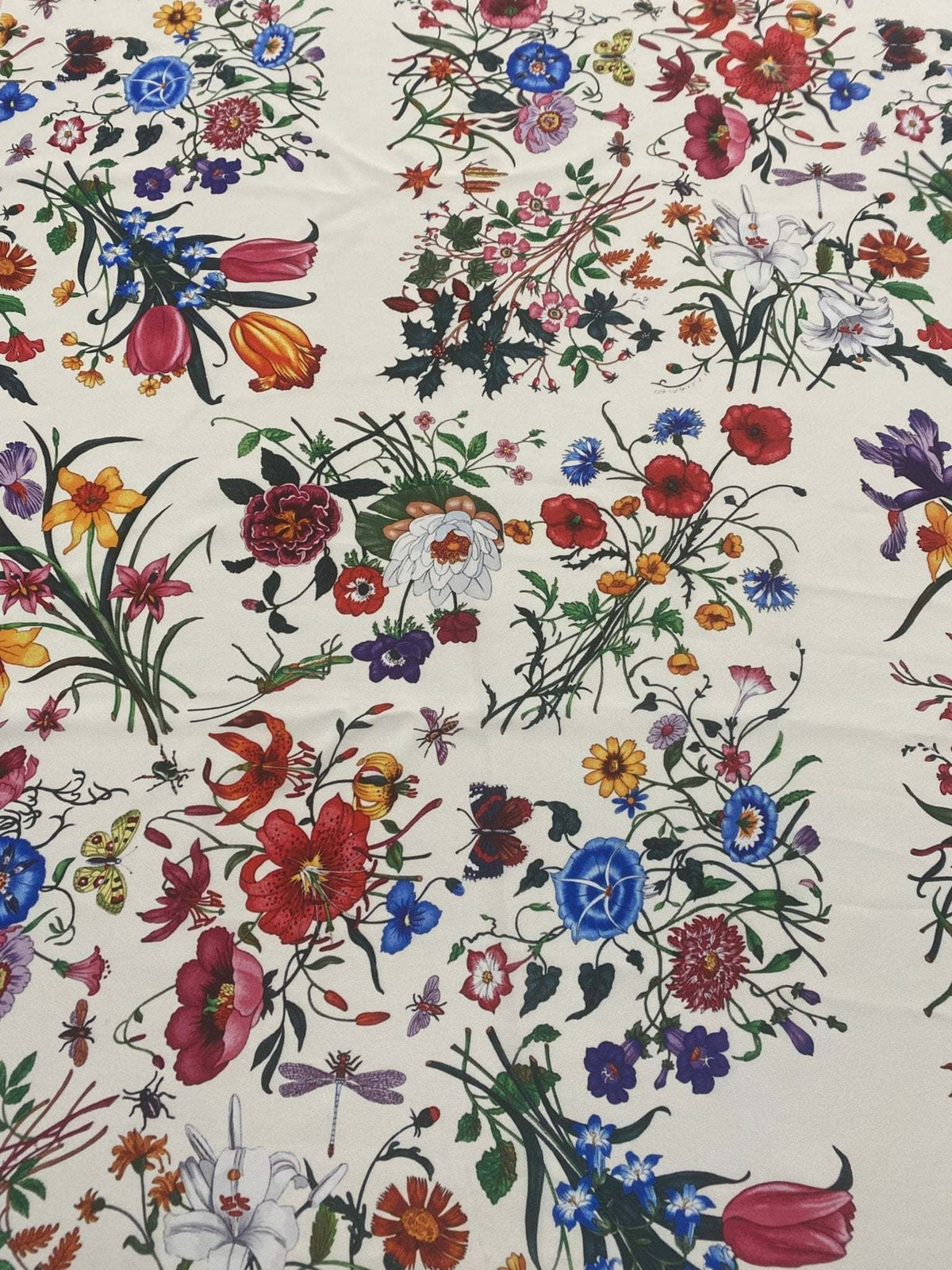 Cream floral botanical print fabric with colorful flowers on a cream background, ideal for sewing and home decor projects