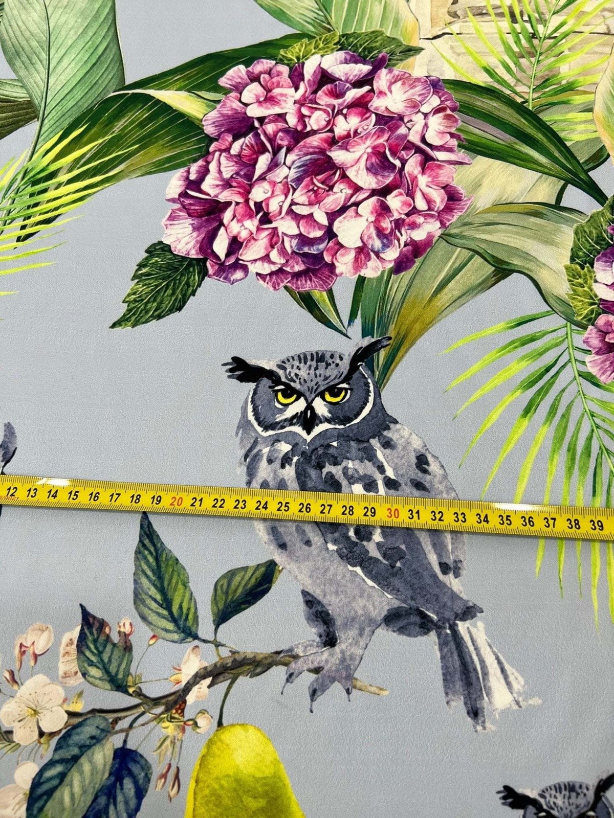 Tropical parrot print crepe fabric with colorful floral and foliage design and owl illustration
