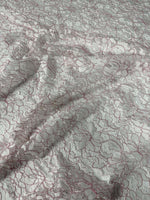 White and pink elegant lace embroidered fabric with floral design for sewing and crafting projects
