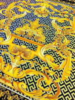 Gold Baroque Greek Key Pattern Fabric in silky crepe with intricate gold and black baroque design and Greek key motifs.