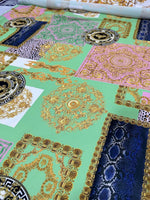 Green Baroque Crepe Fabric with ornate floral and geometric patterns on a mint green background