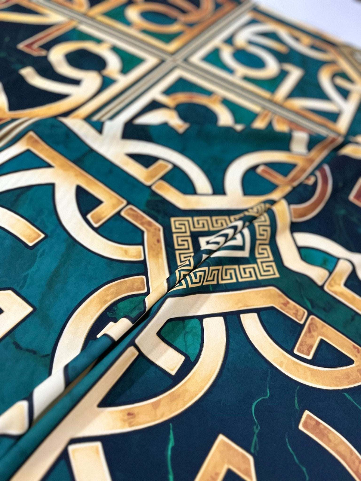 green gold crepe silky fabric with Greek key pattern and smooth texture