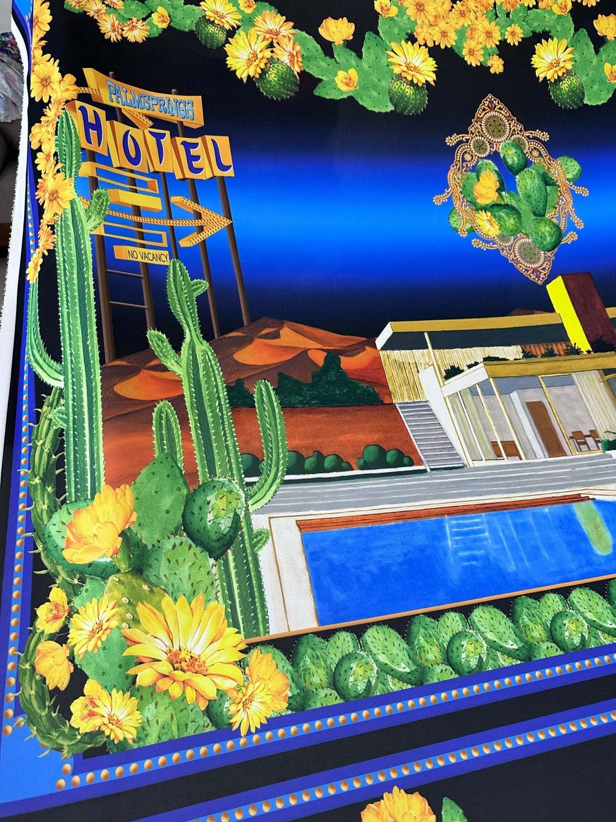 Palm Springs Retro Hotel Print Fabric with vintage desert motel and cactus design on vibrant blue background