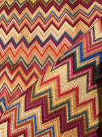 Colorful zigzag chevron upholstery fabric with vibrant digital print, ideal for outdoor use and upholstery projects.