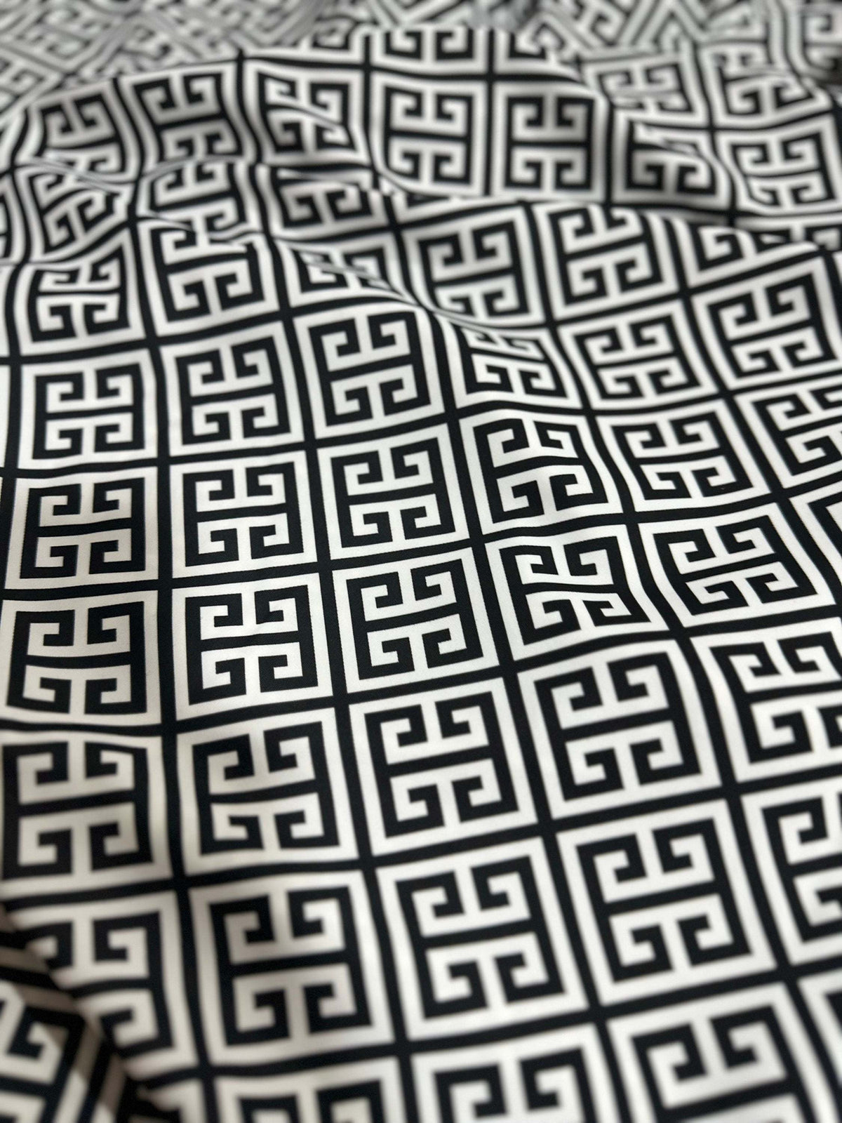 Black and white Greek Key Pattern Fabric with intricate geometric design, suitable for upholstery and drapery projects