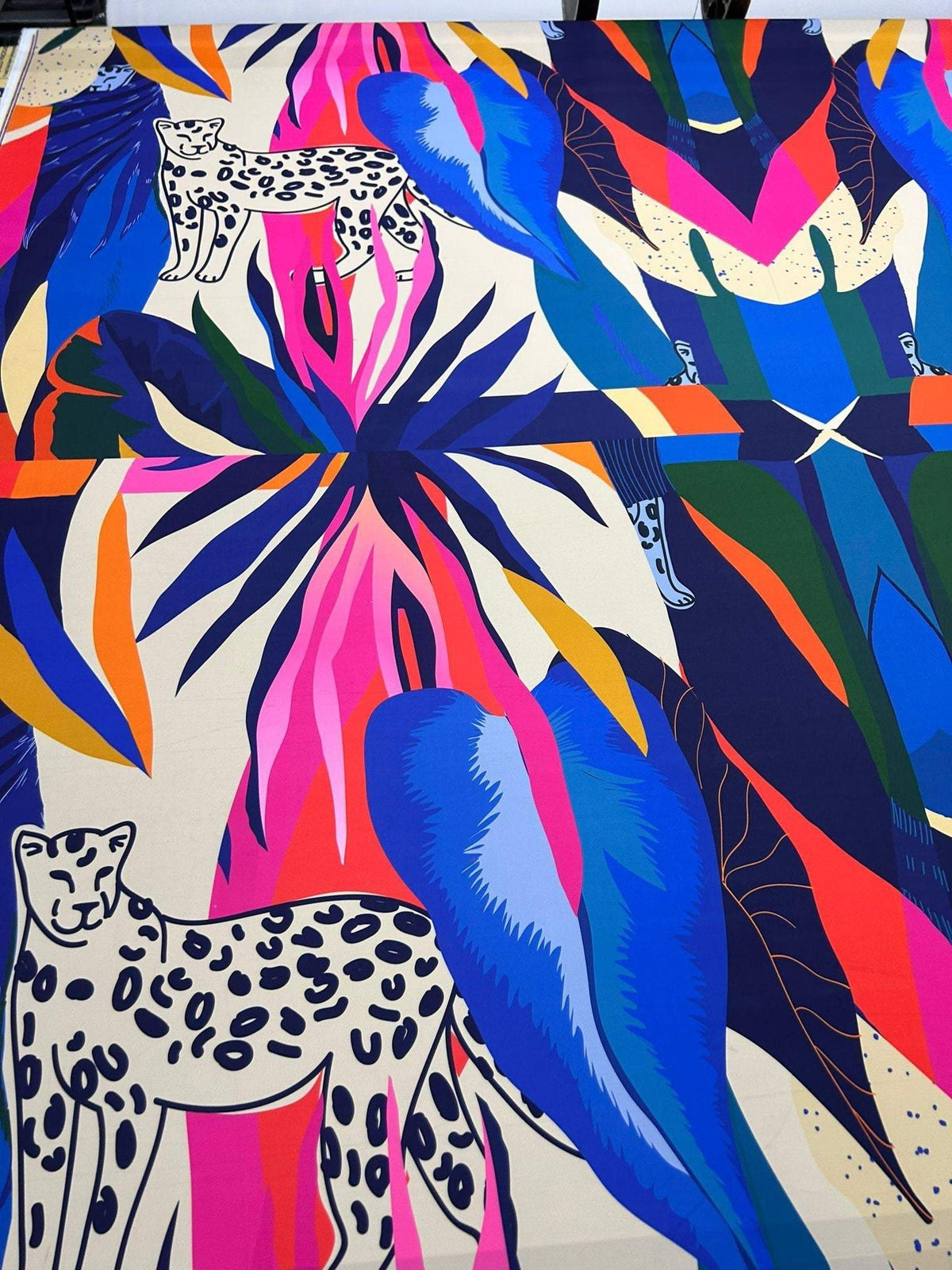 Colorful leopard and tropical pattern fabric with vibrant leaves and animal motifs, 150cm wide, soft and durable material.