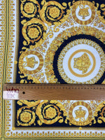 Luxurious Baroque Medusa black and gold fabric with intricate ornate pattern and ruler for scale
