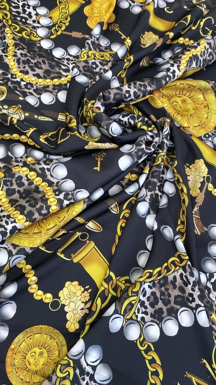 Black luxury baroque fabric with gold chain, leopard print, and pearl design
