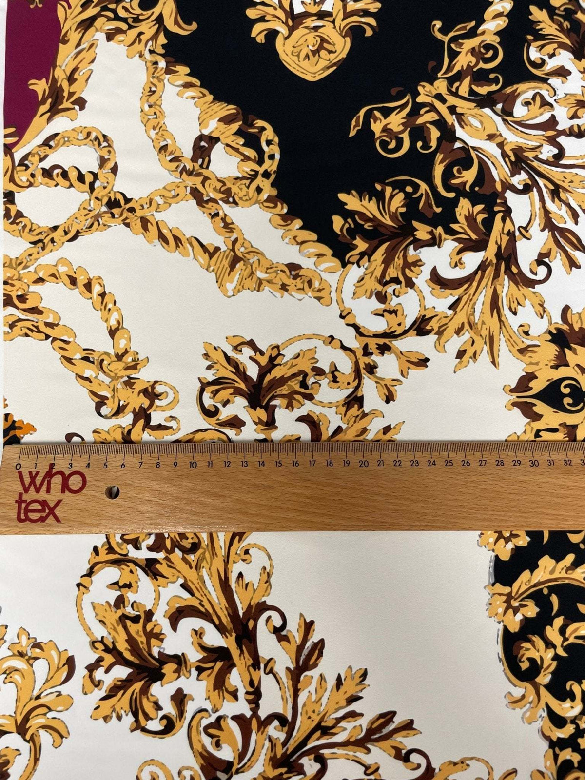Luxury Baroque Zebra Chain Fabric with burgundy, gold, and black Baroque and chain patterns on soft material