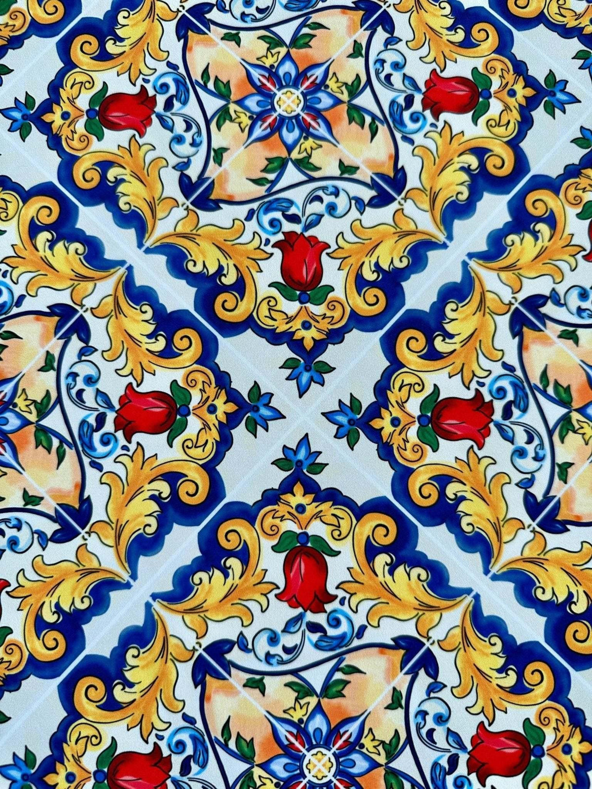 Bright Sicilian Majolica pattern fabric with intricate floral and ornamental designs in blue, yellow, red, and green colors