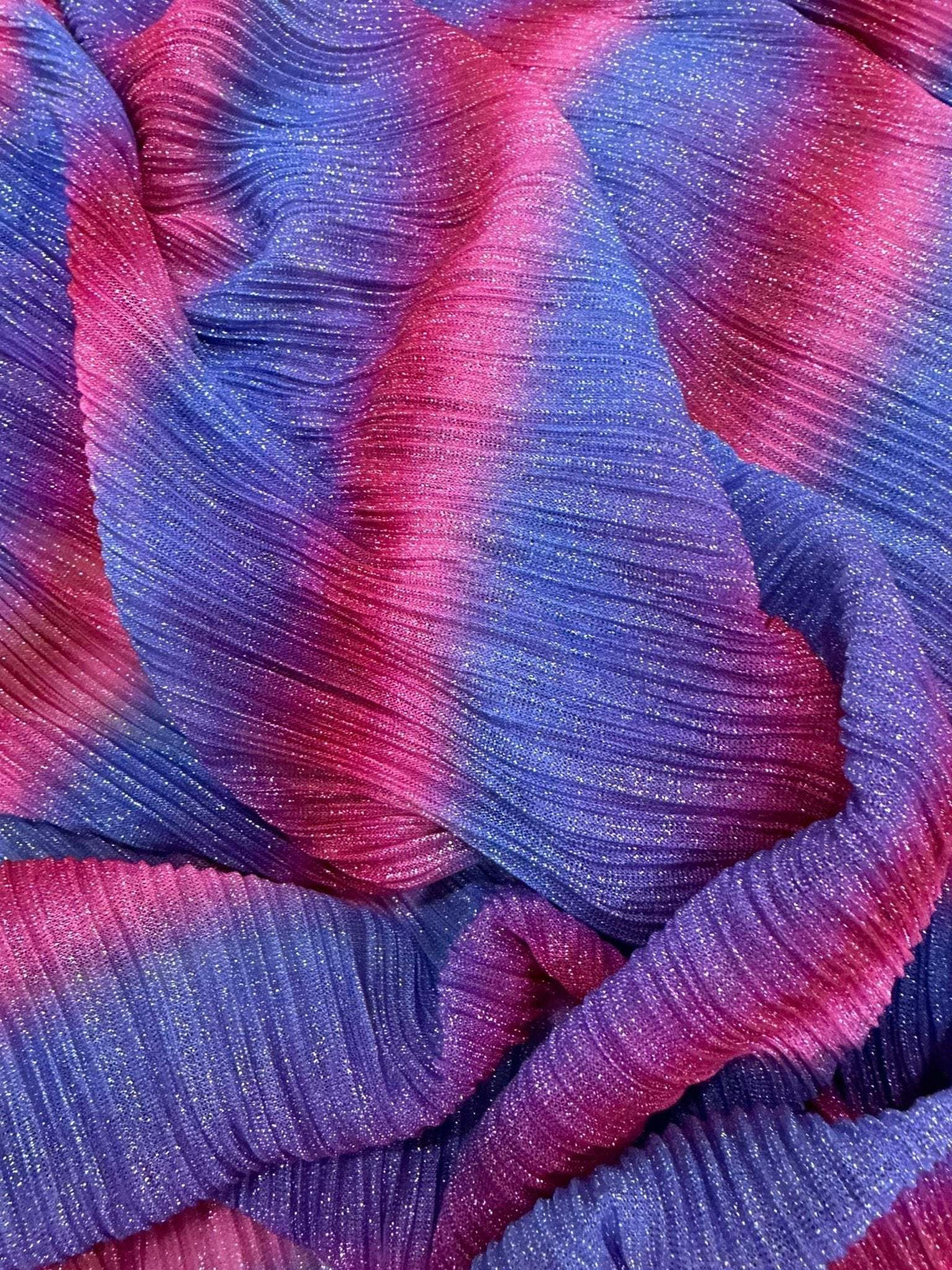 Pleated power mesh fabric with shiny threads in pink and purple hues, lightweight and soft texture