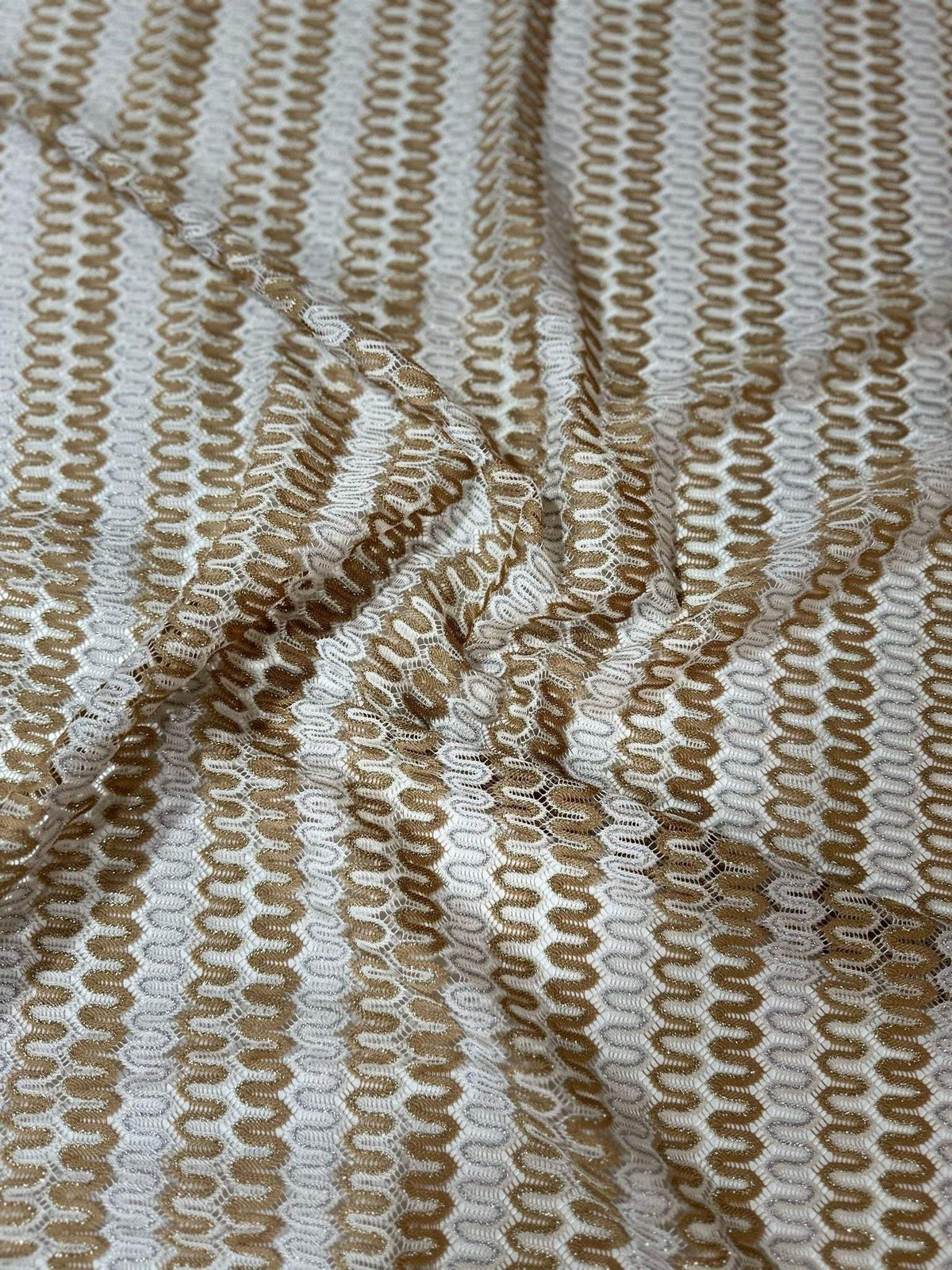 Soft beige and cream Shimmer Zigzag Knit Jersey fabric with chevron pattern and shimmering texture