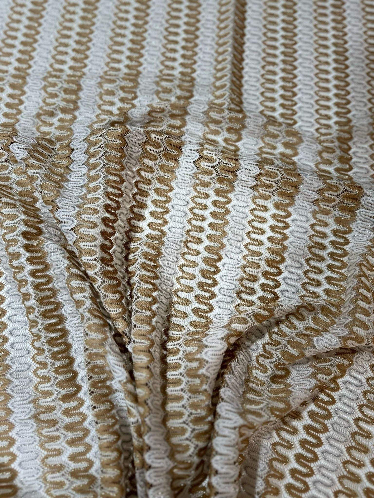 Shimmer zigzag knit jersey fabric in beige and cream chevron pattern with soft, lightweight texture