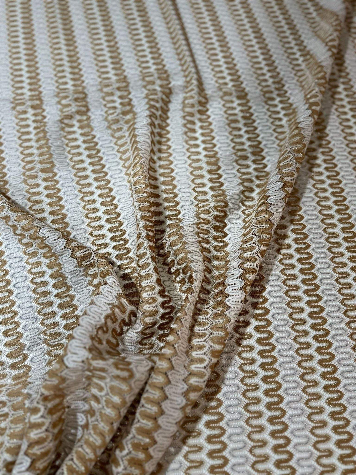 Shimmer Zigzag Knit Jersey fabric in soft beige and cream chevron pattern with lightweight, breathable knit texture