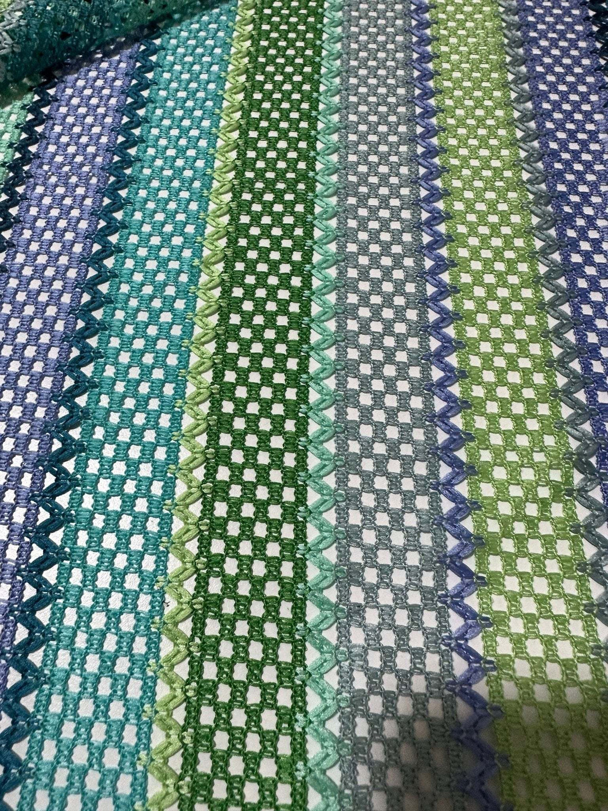 Striped knit mesh fabric with green and blue zigzag pattern for creative sewing projects
