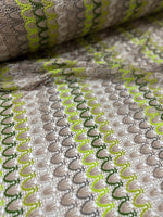 Beige green zigzag knit jersey mesh fabric with soft stretchy texture for clothing and crafts