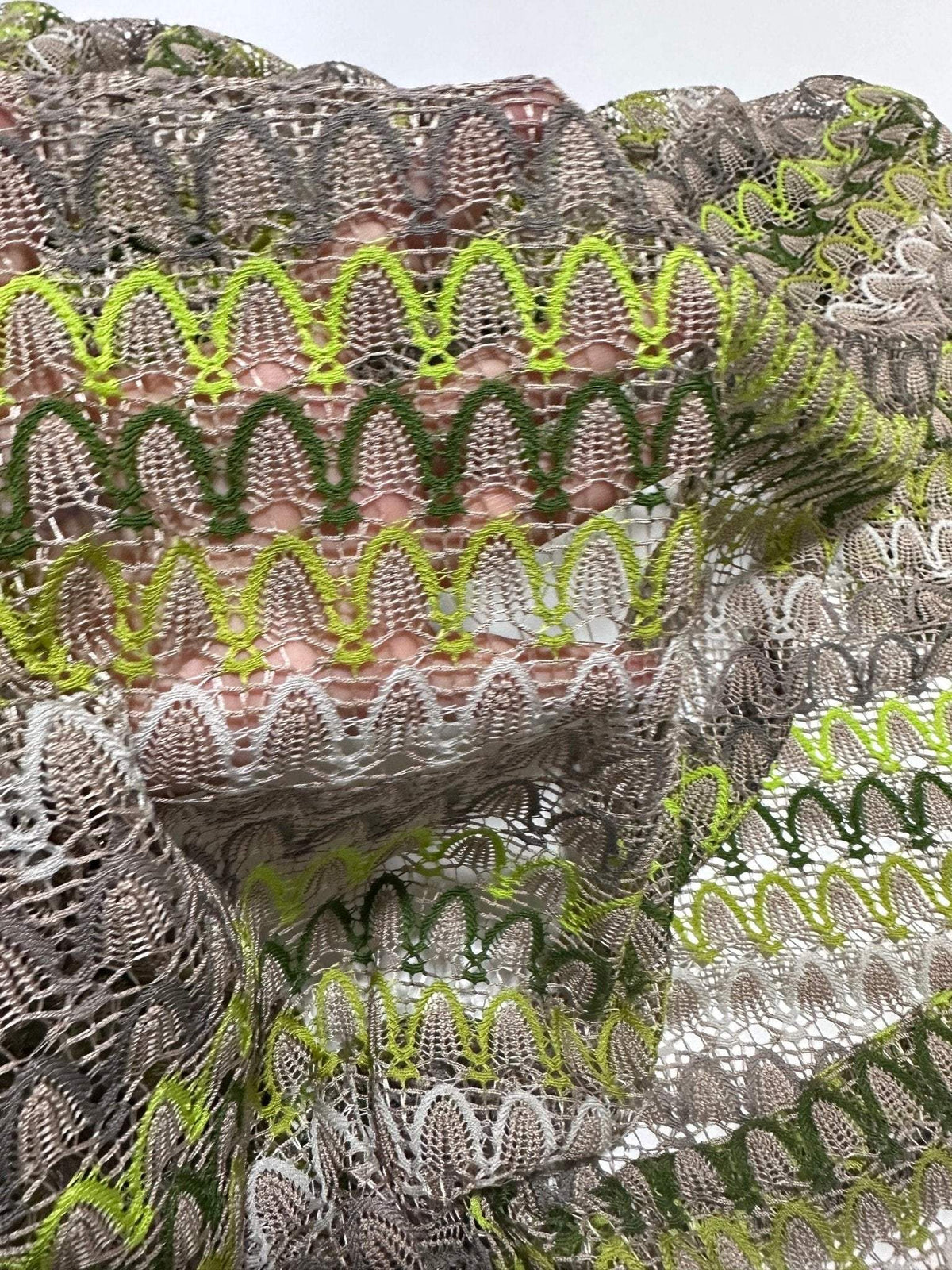 Beige green zigzag knit jersey mesh fabric with soft stretchy texture for clothing and crafts