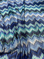Zigzag knitted mesh fabric with blue and white chevron pattern, soft stretch knit for clothing projects