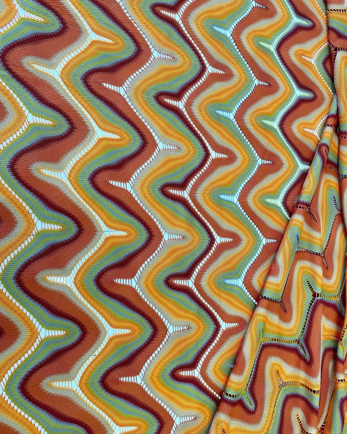 Zigzag Knit Jersey Mesh Fabric with multicolor zigzag pattern in warm tones, soft textured knit for fashion and craft projects