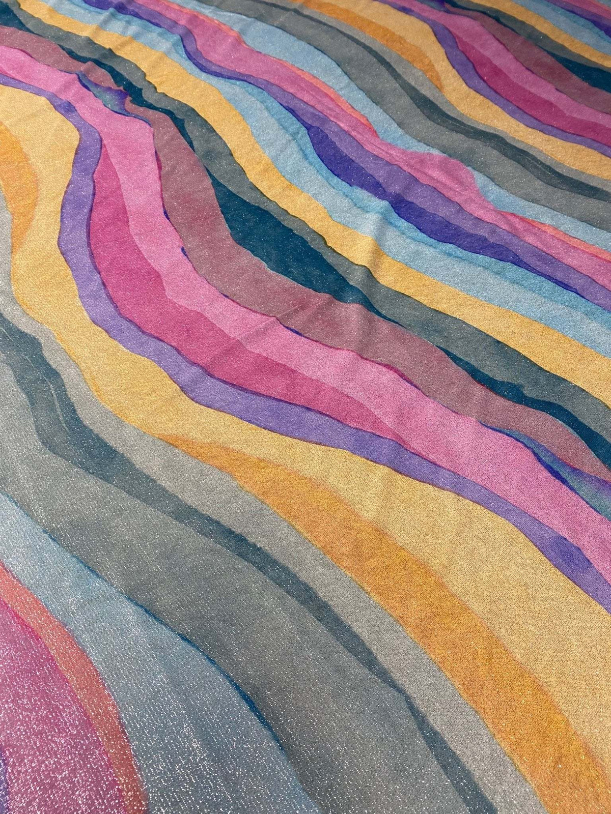 Multicolor shimmer Lurex fabric with glitter and wavy multicolor stripes, ideal for activewear and costumes
