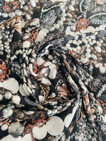 Black jewelry fabric with elegant pearl and gemstone pattern for stylish accessories