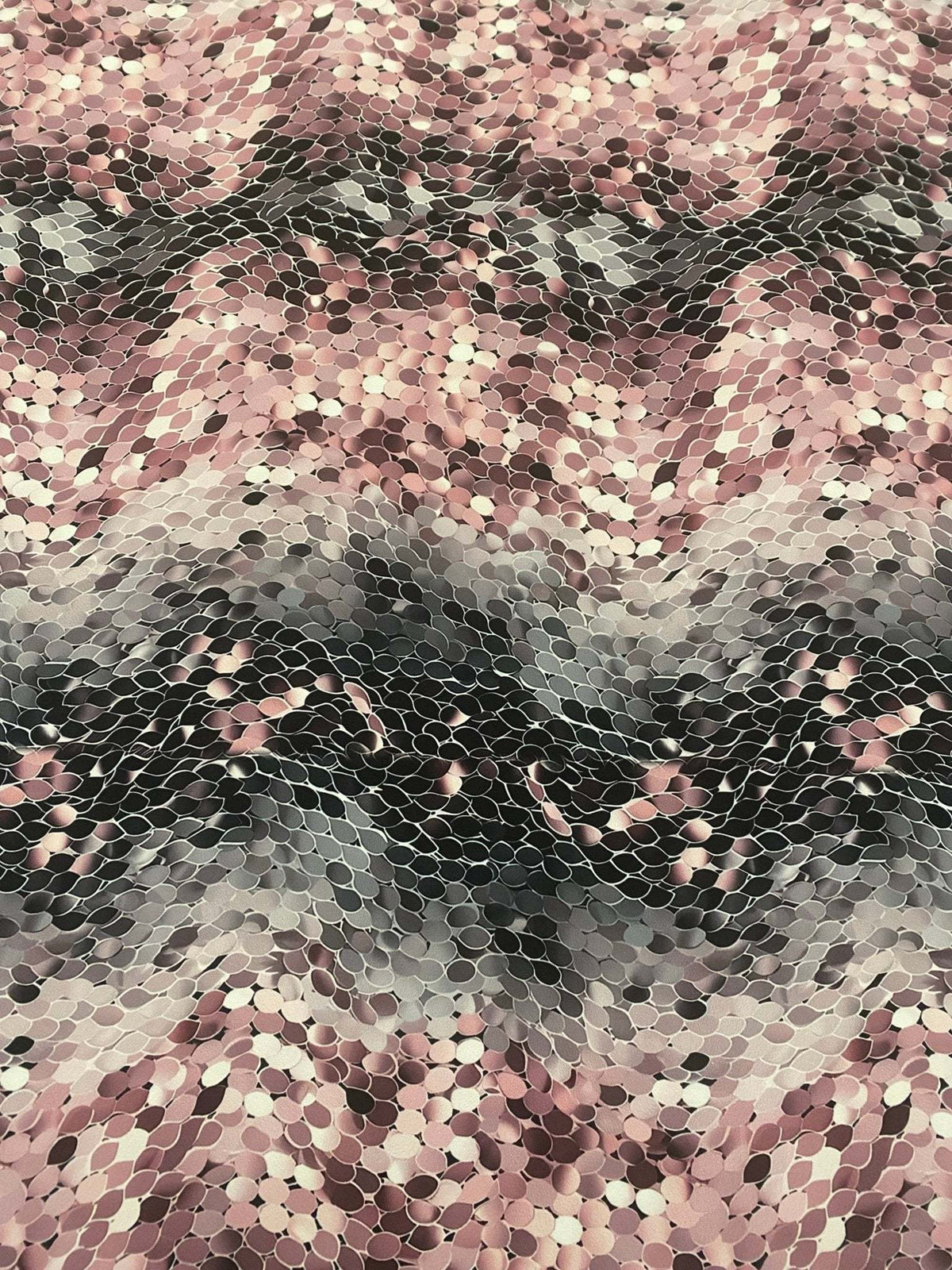 Pink and black abstract scales print fabric with textured optical illusion pattern, 150cm wide