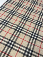 Plaid woolen fabric with beige base and black, white, and red check pattern suitable for jackets and coats