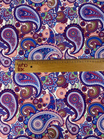 Purple paisley upholstery fabric with intricate digital print featuring blue, red, and green paisley and floral patterns.