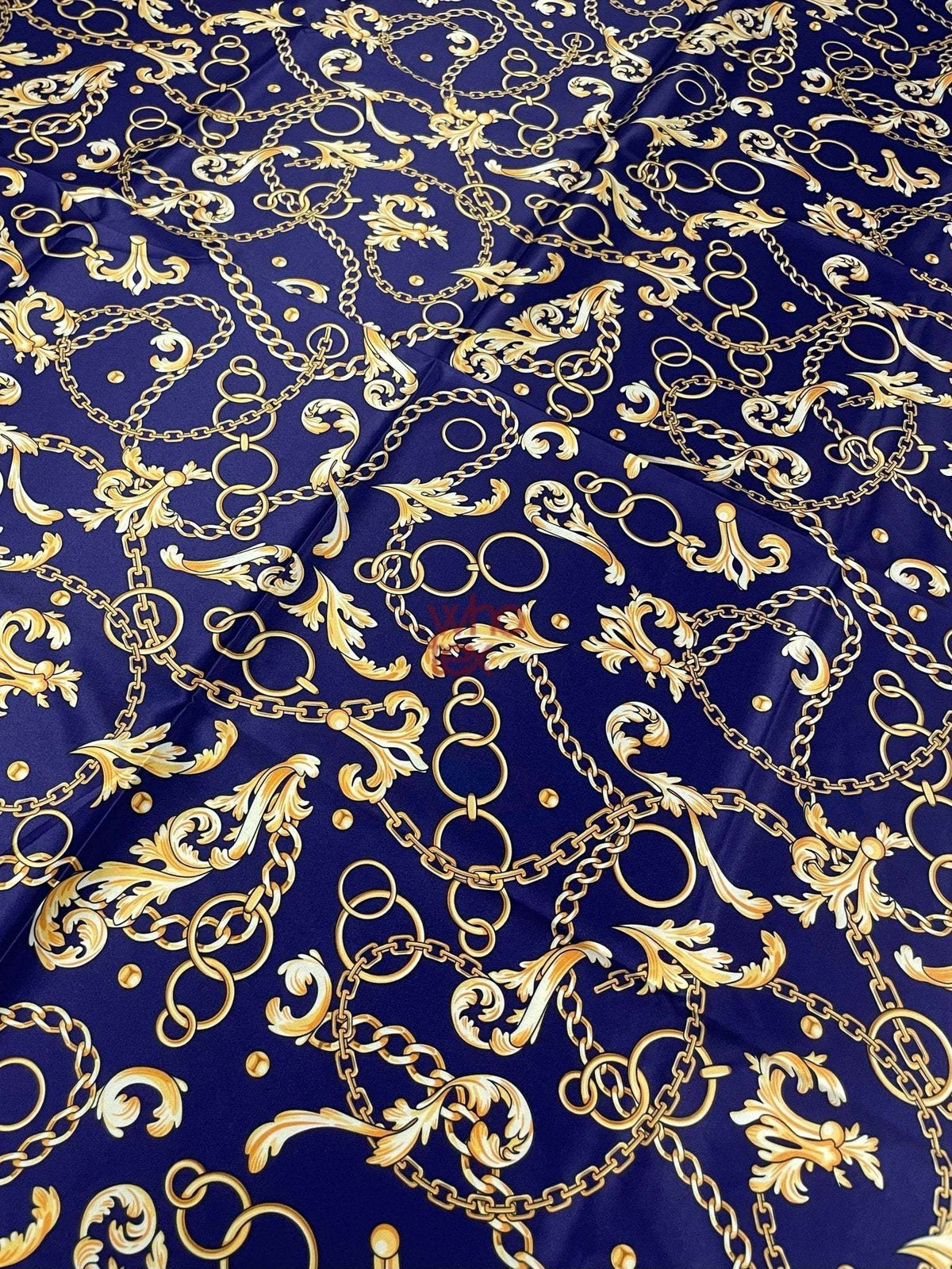 Royal blue fabric with gold chains and baroque scrolls pattern