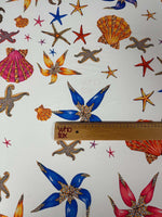 Sea Shell Fabric with colorful starfish and seashell prints on white background, fabric width 150cm.