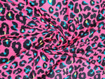 Sugar pink leopard print fabric with vibrant blue and yellow accents, 150cm wide, suitable for clothing and crafts