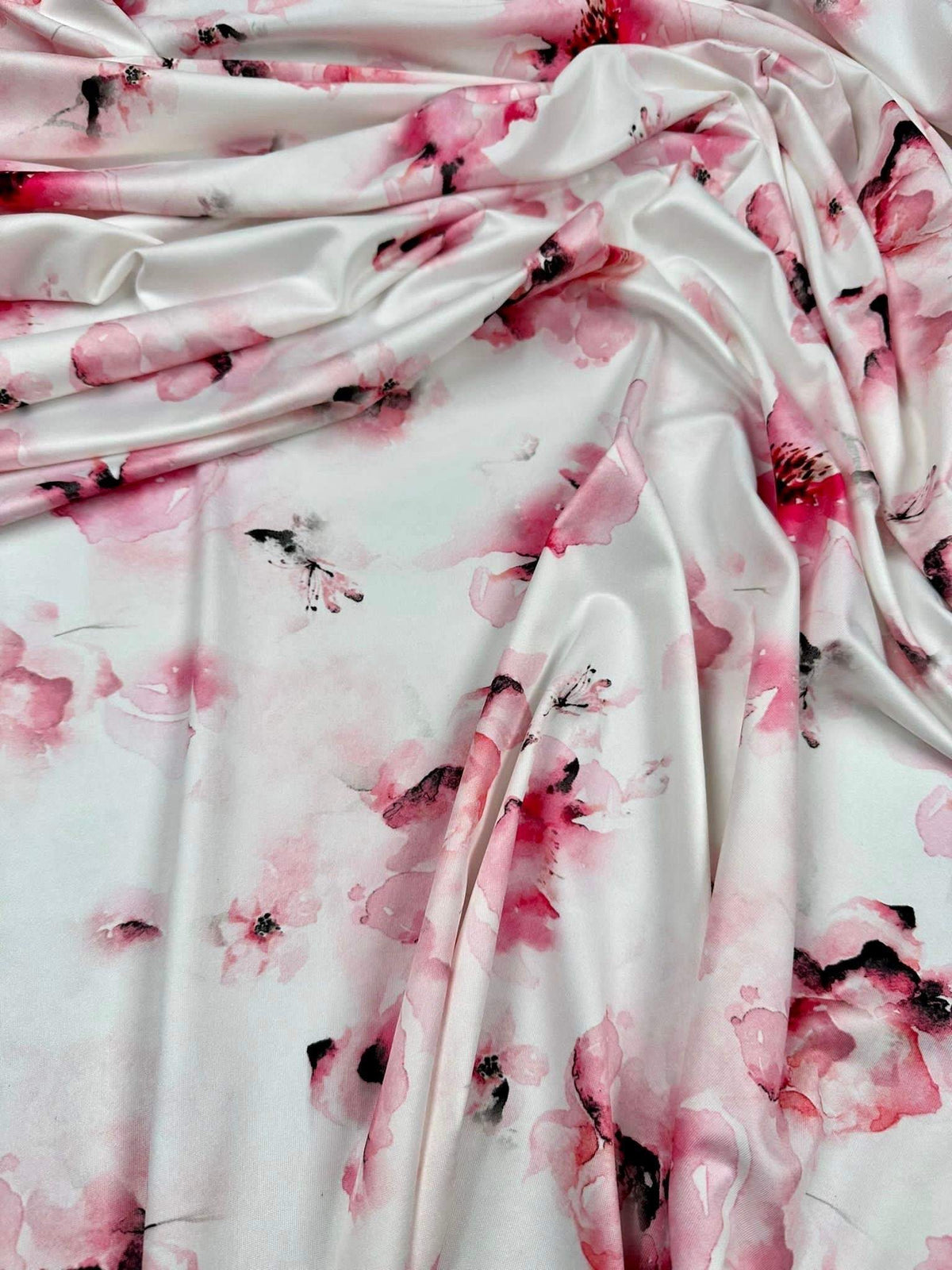Soft watercolor floral fabric with pink and white pattern for sewing and crafting projects