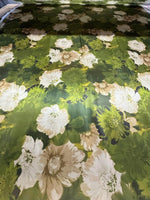 Watercolor floral fabric with green background and white and beige flowers, soft texture for sewing and crafts, 150cm wide