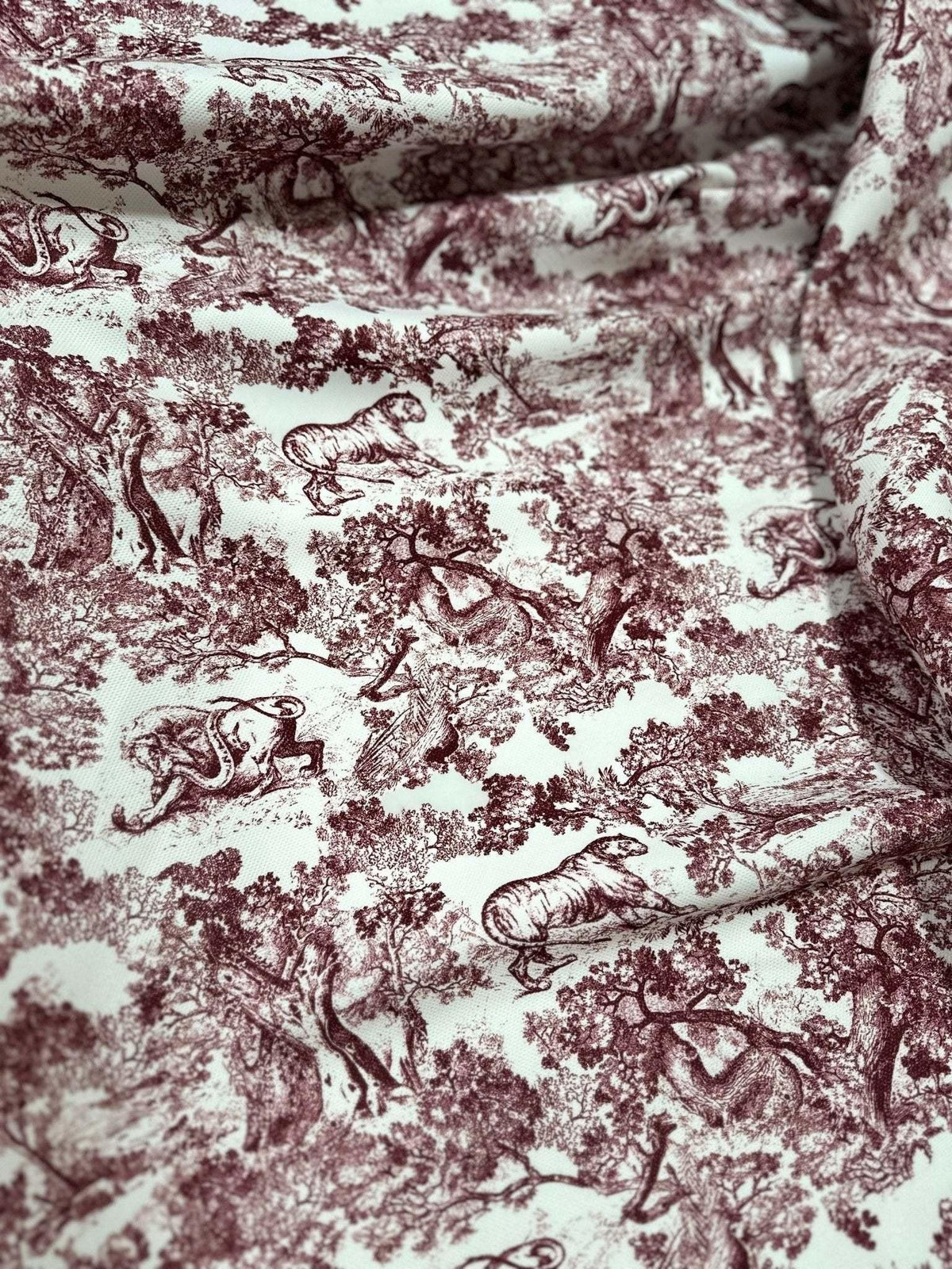 Brown wild forest pattern fabric with white animal illustrations and tree designs, 150cm wide textile for sewing projects and home decor.