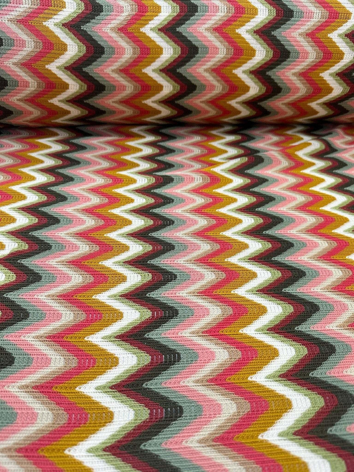 Luxury autumn chevron zigzag knit jersey fabric in warm, vibrant colors with a 150cm width.